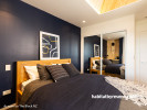 navy bedroom, boys bedroom, dark blue feature wall, teenagers bedroom, wood headboard