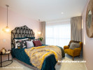 bedroom, guest bedroom, pink bedroom, peacock blue luxe, fabric headboard, mustard armchair 