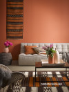 living room, lounge, earthy tones, terracotta feature wall, terracotta lounge, African inspired