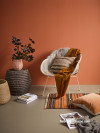 Occasional chair, warm oranges, natural fibres, rug, reading corner, Resene